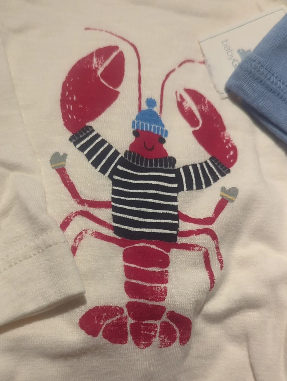 Cream Baby Bodysuit with Red Lobster Graphic and Light Blue Star Hat